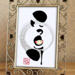 『にっこり』を筆文字で書いたアート作品
